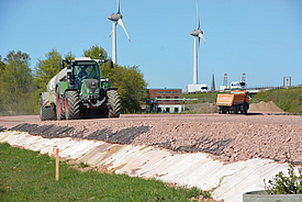 Construction road for the access road to the wind turbine Temporary construction road is driven on by a tractor