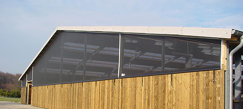 Clamping variant on indoor riding arena The gable of the indoor riding arena clad with the Lubratec tensioning variant