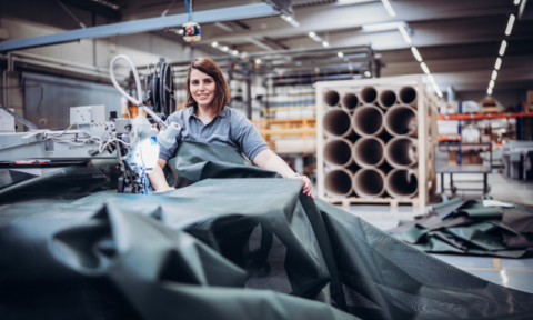 HUESKER employee with material HUESKER employee works with a material